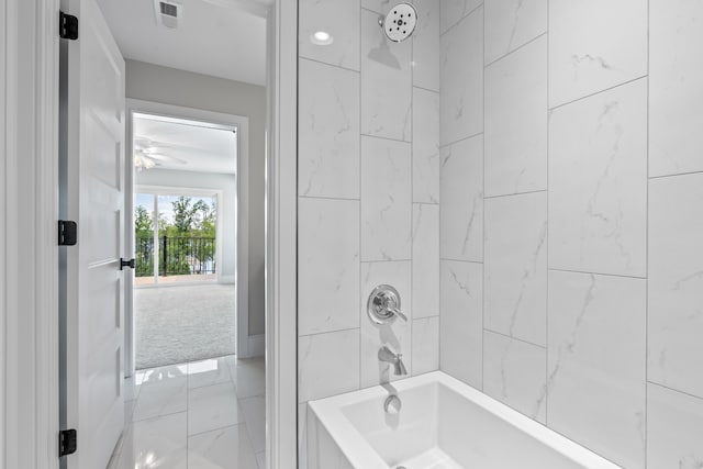 bathroom featuring shower / bathing tub combination and ceiling fan