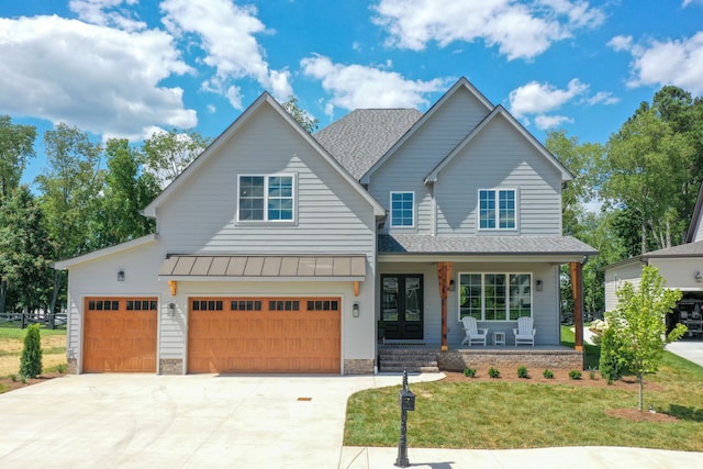 view of front of property with covered porch and a front yard