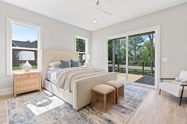 bedroom with access to outside, ceiling fan, and light hardwood / wood-style floors