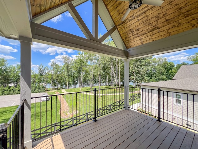 deck with ceiling fan and a yard