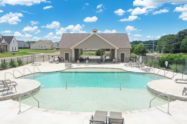 view of swimming pool with a patio area