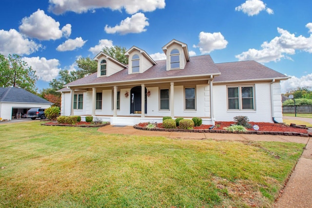 cape cod-style house with a front yard and a porch