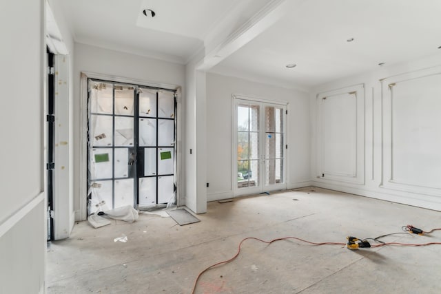 interior space featuring beamed ceiling and ornamental molding