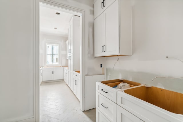 kitchen featuring white cabinets