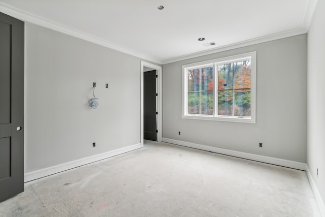 spare room with crown molding