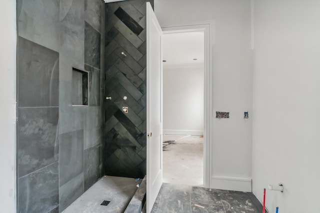 bathroom with tiled shower