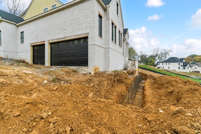 view of home's exterior with a garage