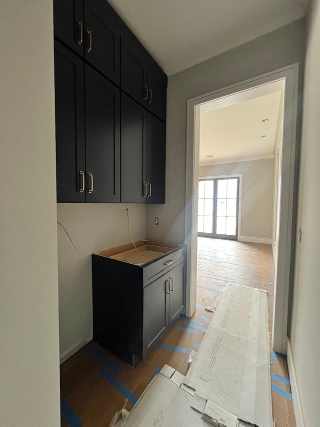 kitchen with light wood finished floors and baseboards