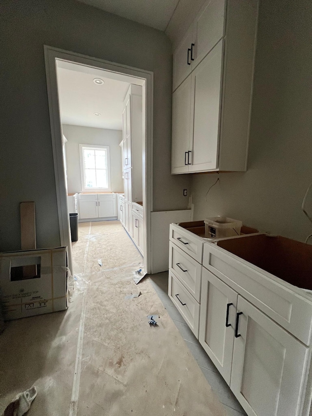 kitchen featuring white cabinetry