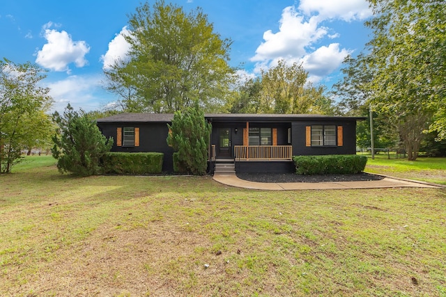 ranch-style house with covered porch and a front yard