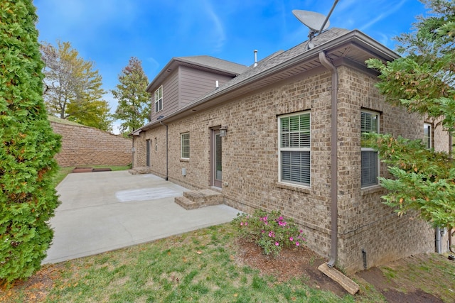 view of home's exterior with a patio