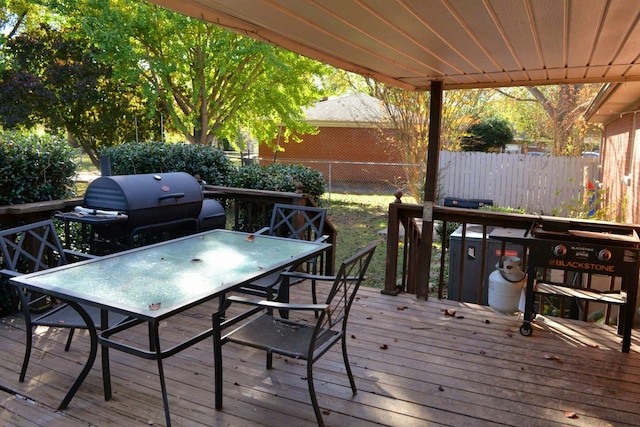 wooden terrace with area for grilling