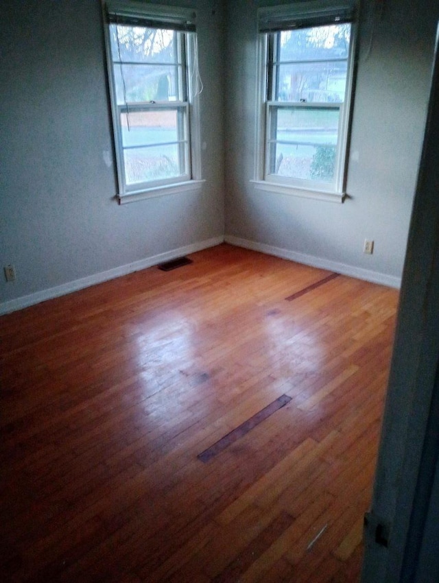 empty room featuring hardwood / wood-style floors