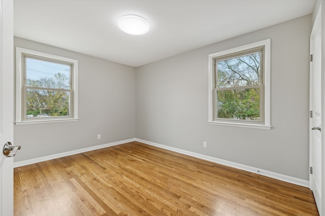 spare room featuring light wood-type flooring