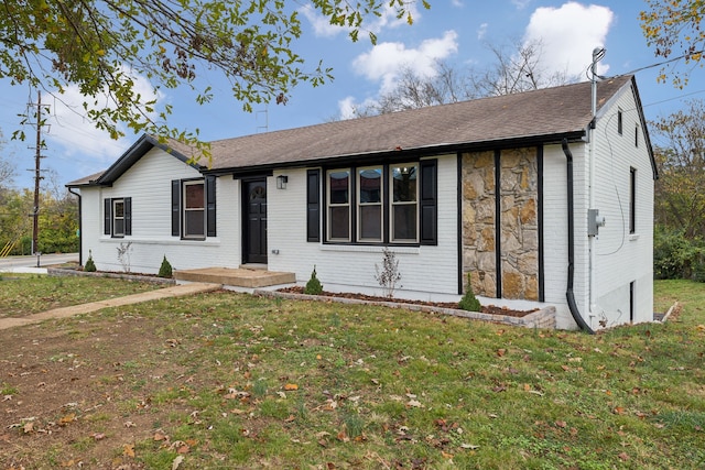 single story home with a front yard