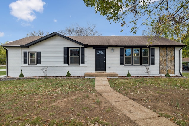 ranch-style house featuring a front lawn