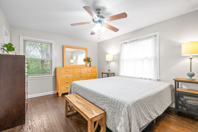 bedroom featuring ceiling fan and dark hardwood / wood-style floors