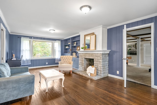 living room with a fireplace, dark hardwood / wood-style floors, and crown molding