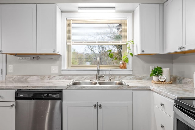 3 Hillwood Ct, Clarksville, TN 37043 - kitchen with stainless steel dishwasher, a sink, light countertops, and white cabinetry