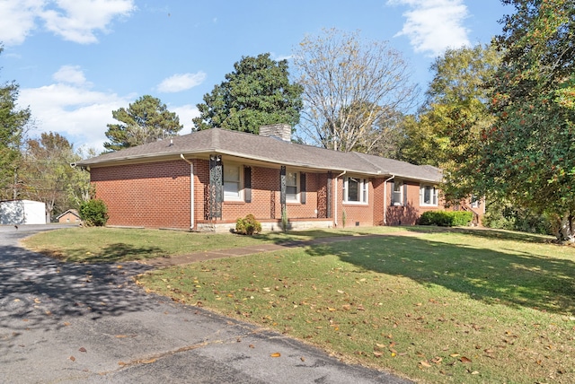 ranch-style home with a front lawn