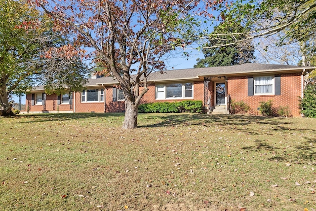 single story home featuring a front yard