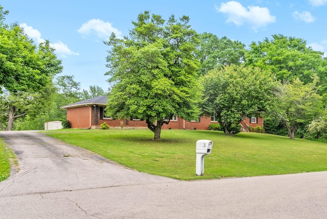 3 Hillwood Ct, Clarksville, TN 37043 - obstructed view of property with a front yard, brick siding, and asphalt driveway