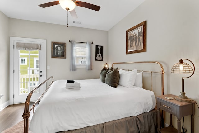 bedroom with light wood-type flooring, multiple windows, and ceiling fan