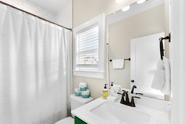 bathroom with vanity and toilet