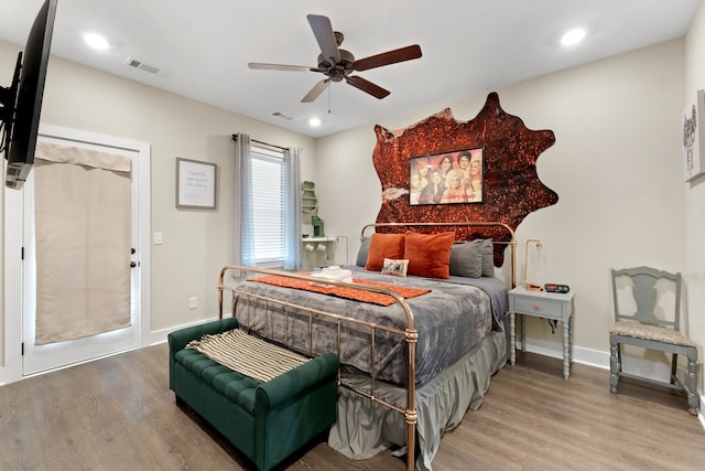 bedroom with hardwood / wood-style flooring and ceiling fan