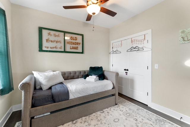 bedroom featuring hardwood / wood-style flooring and ceiling fan