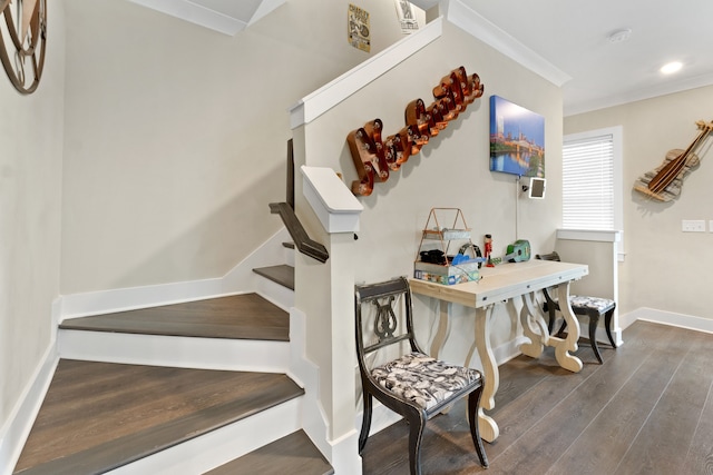 stairway featuring ornamental molding and hardwood / wood-style floors