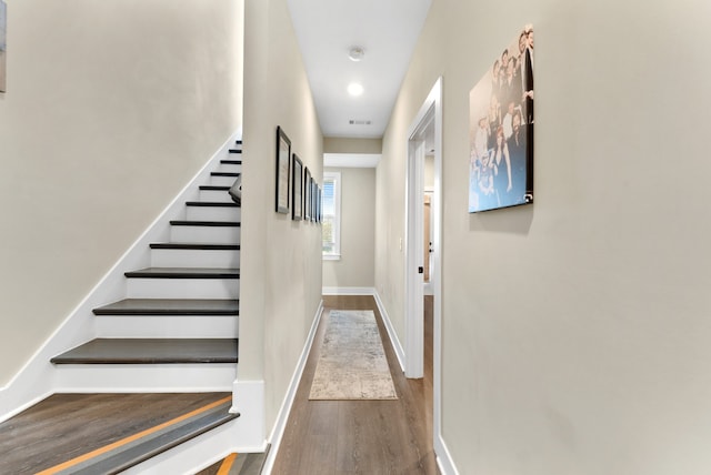 corridor with dark wood-type flooring