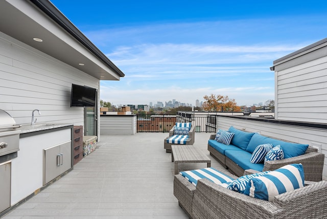 view of patio / terrace featuring an outdoor living space and sink