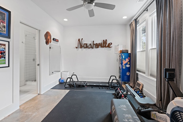 exercise room with concrete flooring and ceiling fan