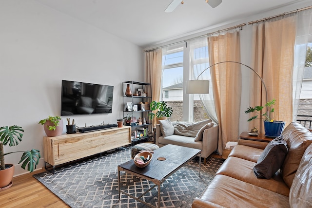 living room with hardwood / wood-style flooring and ceiling fan