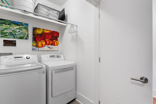 clothes washing area featuring washing machine and clothes dryer