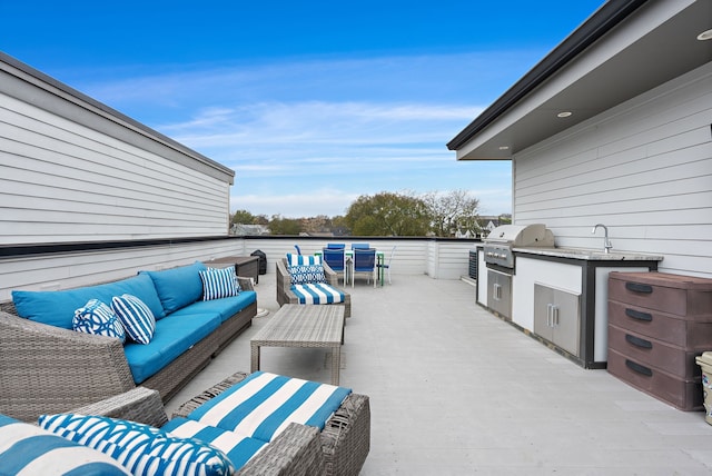 view of patio featuring an outdoor living space, exterior kitchen, and a grill