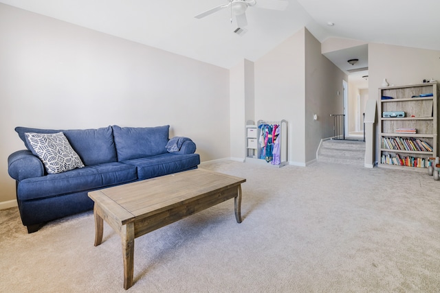 living room with vaulted ceiling, light carpet, and ceiling fan