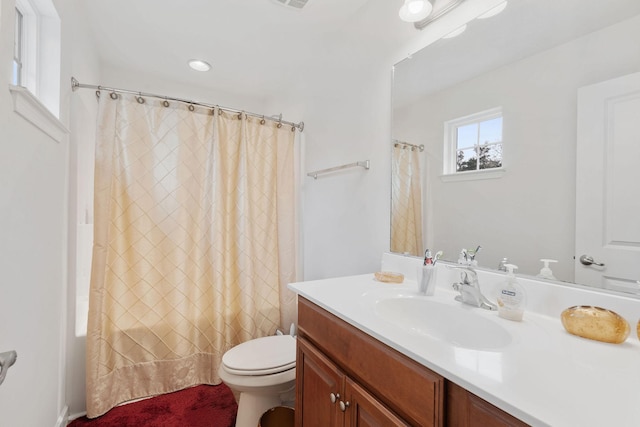 full bathroom featuring vanity, toilet, and shower / tub combo with curtain