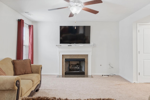 living room with carpet flooring and ceiling fan