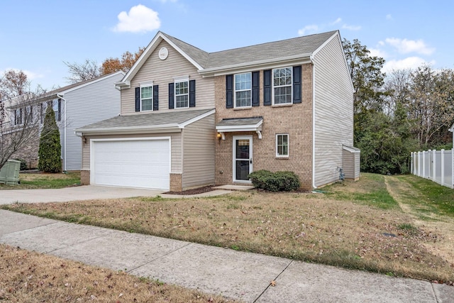 view of front of home with a front yard and a garage