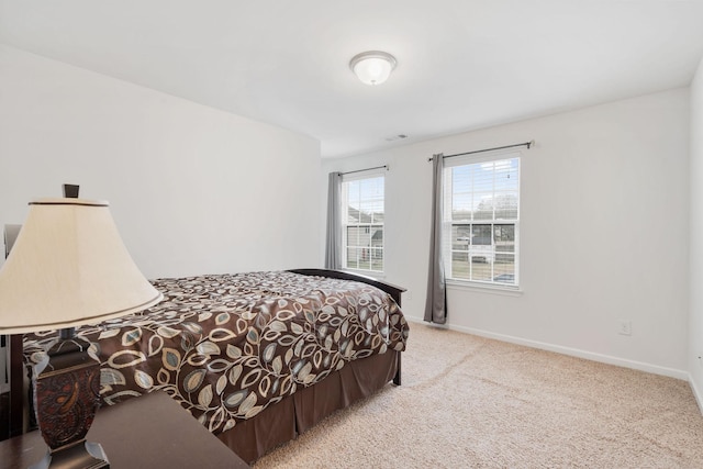 bedroom featuring light carpet