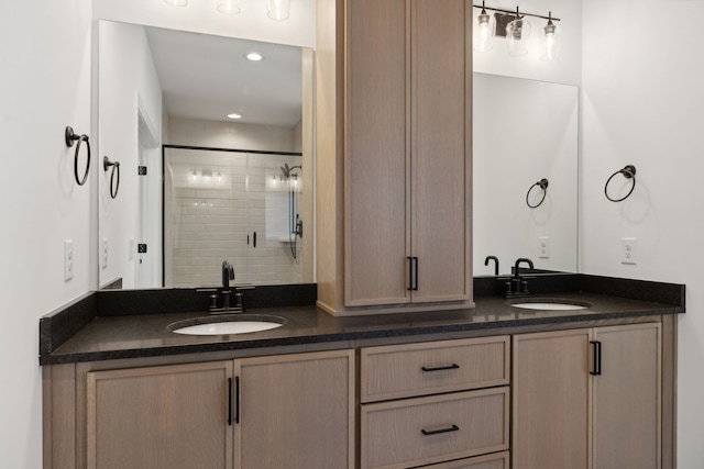 bathroom with walk in shower and vanity