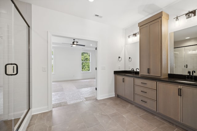 bathroom with ceiling fan, vanity, and a shower with shower door