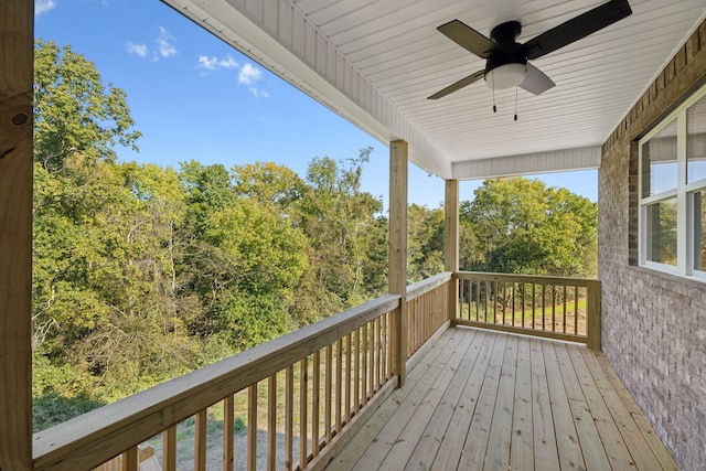 wooden deck featuring ceiling fan