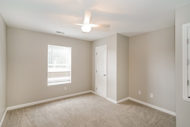 carpeted empty room with ceiling fan