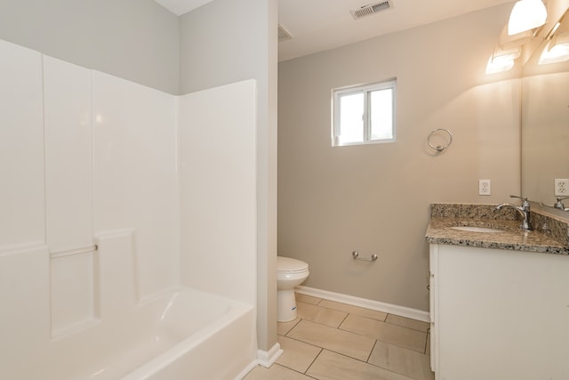 bathroom with tile patterned floors, vanity, and toilet