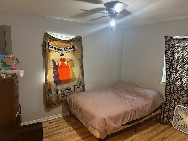 bedroom with wood-type flooring and ceiling fan