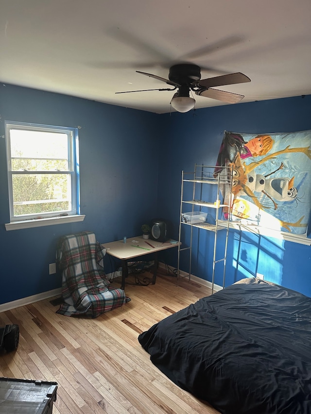 bedroom with hardwood / wood-style flooring and ceiling fan