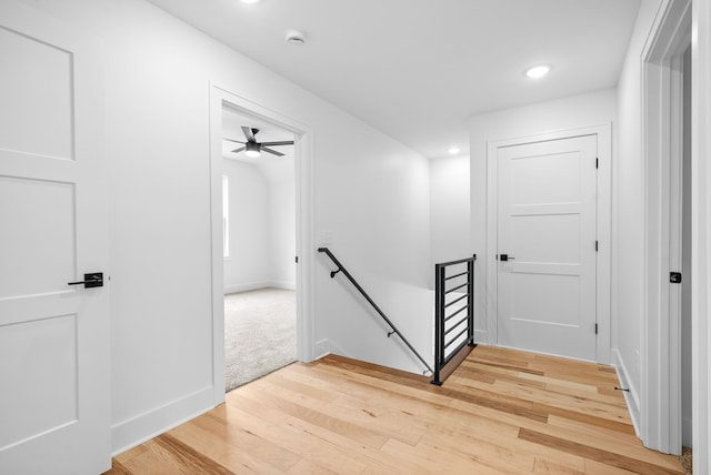 corridor with hardwood / wood-style floors